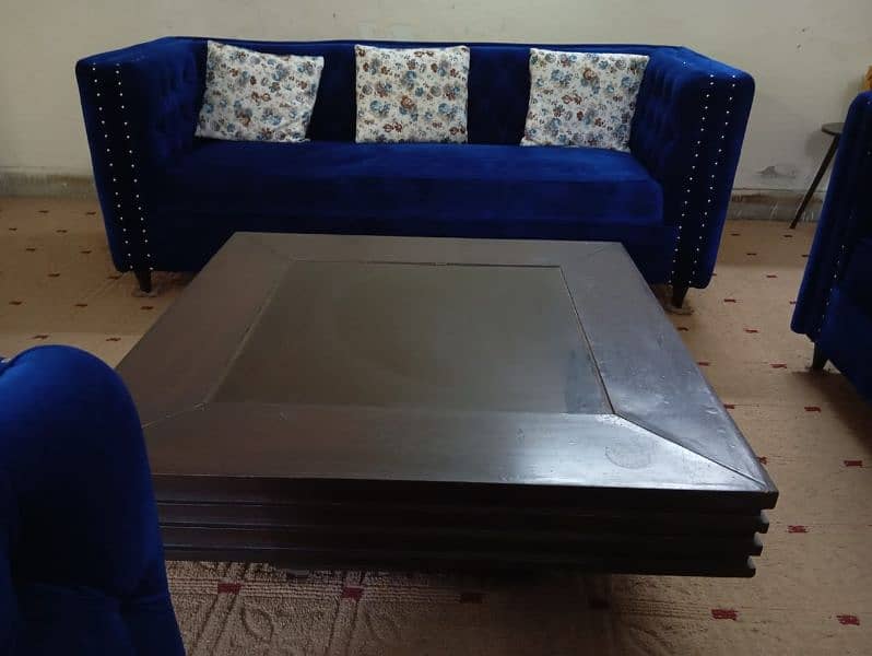 5 seater blue sofa and center table 0