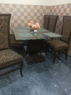 6 solid wood chairs and top glass dining table condition used