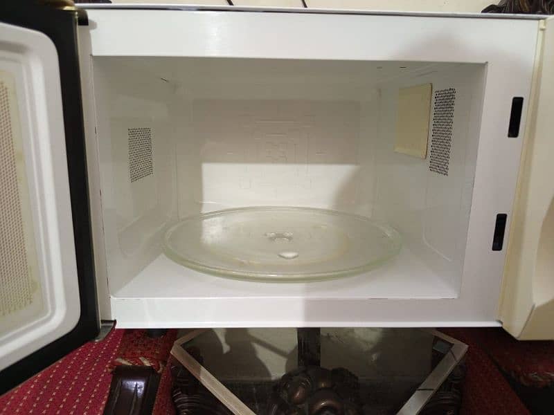 30 liter Haier microwave available for sale. 03289652709 2