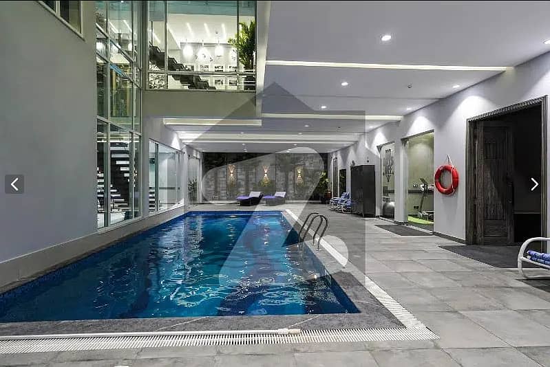 One Kanal BUNGALOW KANAL LAWN Luxury Ultra-Modern Design Most Beautiful Full Basement Swimming Pool Home Theater Bungalow For Sale At Prime Location Of DHA Lahore Near To Commercial Market 40