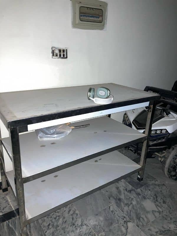 Stainless steel table with 2 compartments. 0