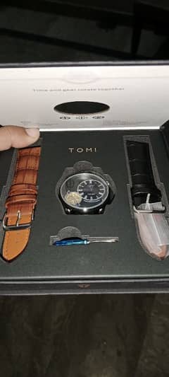 Tomi