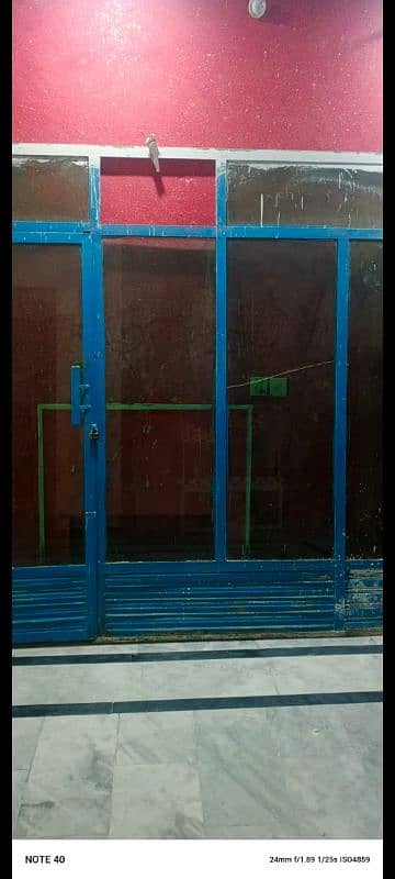 iron frame with mirror to place in front of shop with door 0