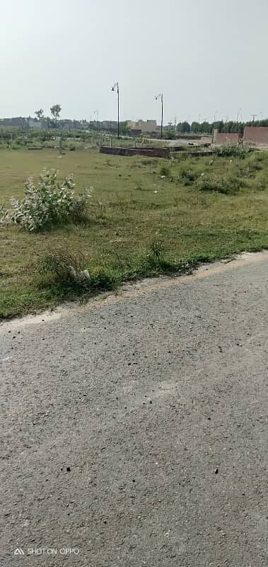 Premium Investment Opportunity 10 Marla Plot in DHA Phase 9 Prism | Direct Ring Road Access 1