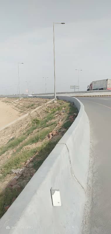 Premium Investment Opportunity 10 Marla Plot in DHA Phase 9 Prism | Direct Ring Road Access 11