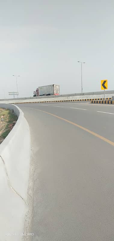 Premium Investment Opportunity 10 Marla Plot in DHA Phase 9 Prism | Direct Ring Road Access 12