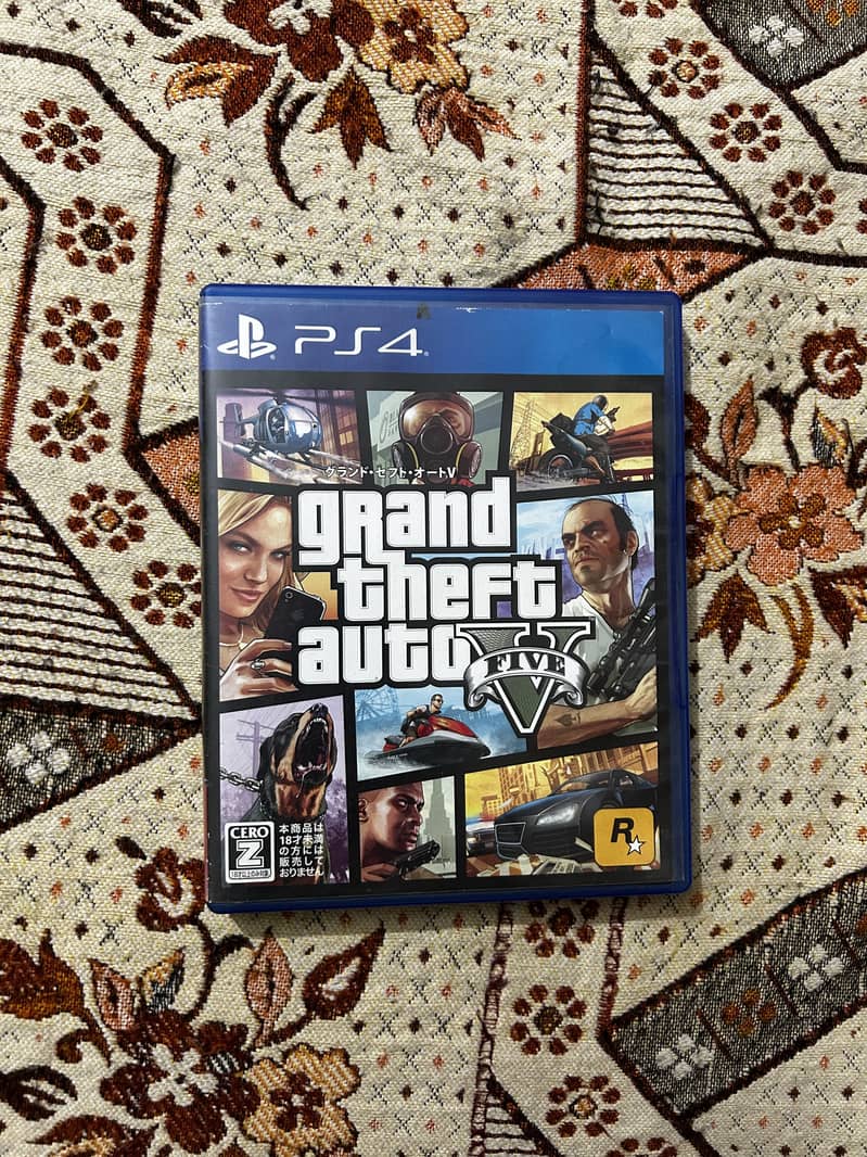 4 ( Ps4 games ) Gta 5, Last of Us remastered,GOW3, Ww2k15 1