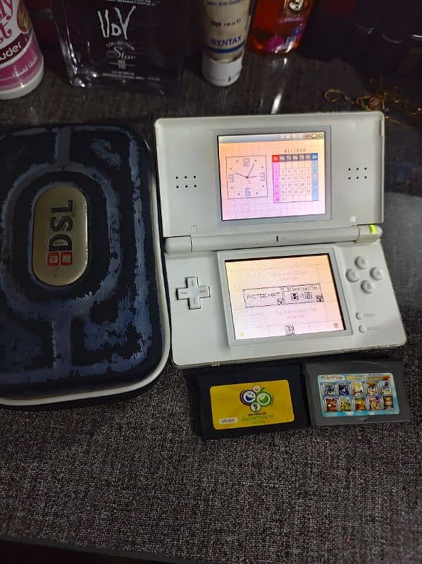 NINTENDO DS LITE WITH 2 CARTS ORIGINAL CHARGER POUCH BUILTIN GAME CART 0