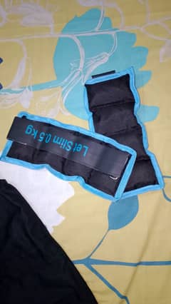 Sensory weighted blanket jackets and handcuffs