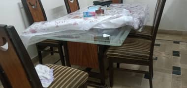 Dinning table with 6 chairs available