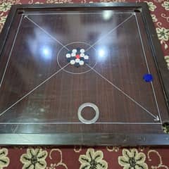 Full size carrom (48 inches) with accessories for sale.