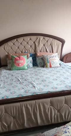 Double bed with side tables and dressing table