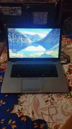 BLACK + GRAY LAPTOP WITH KEYBOARD LIGHT.
