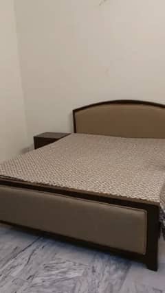 Bed with side table and dresser