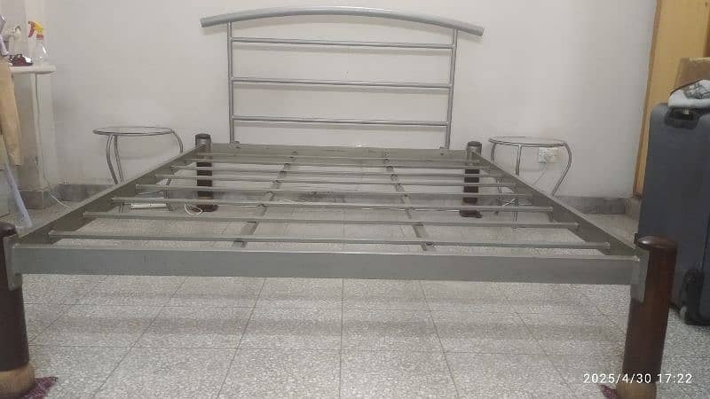 wrought iron bed with round side tables 2