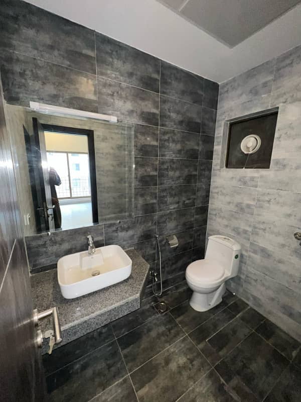 1400sq ft 2BHK Luxurious Apartment in Paragon Towers is available for RENT Near Precinct-17.5min Drive from Main Gate of Bahria Town Karachi 7