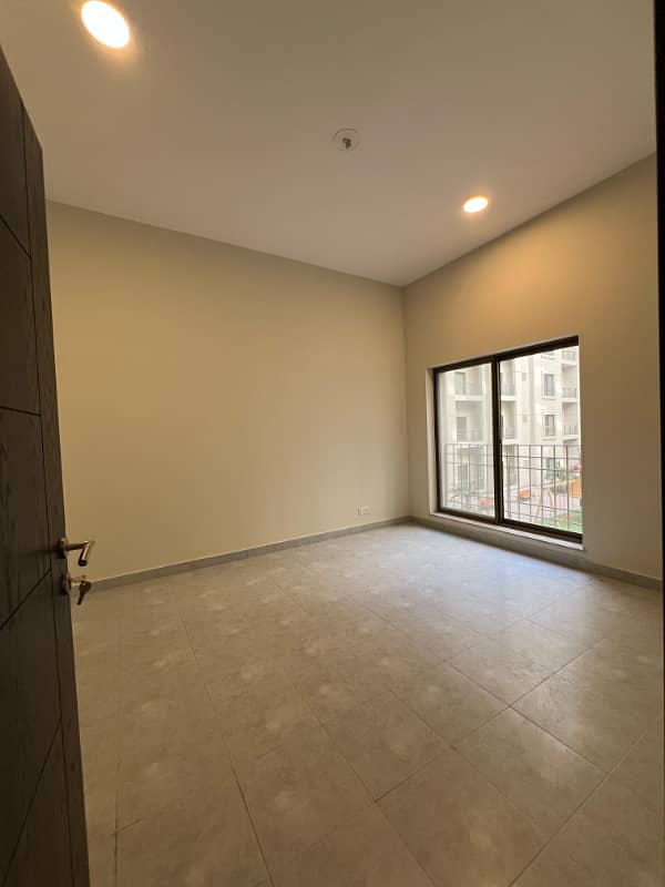 1400sq ft 2BHK Luxurious Apartment in Paragon Towers is available for RENT Near Precinct-17.5min Drive from Main Gate of Bahria Town Karachi 9