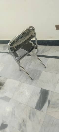 A glass made dinning table and 4 chairs