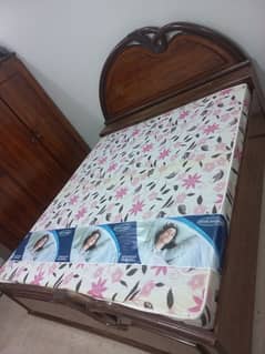 bed with mattress and almari