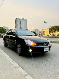Mitsubishi Lancer 2006 automatic own engine better Mira vitz passo