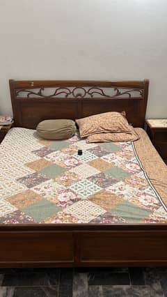 Bed with 2 side tables in good condition.