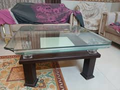 Wooden table with glass top