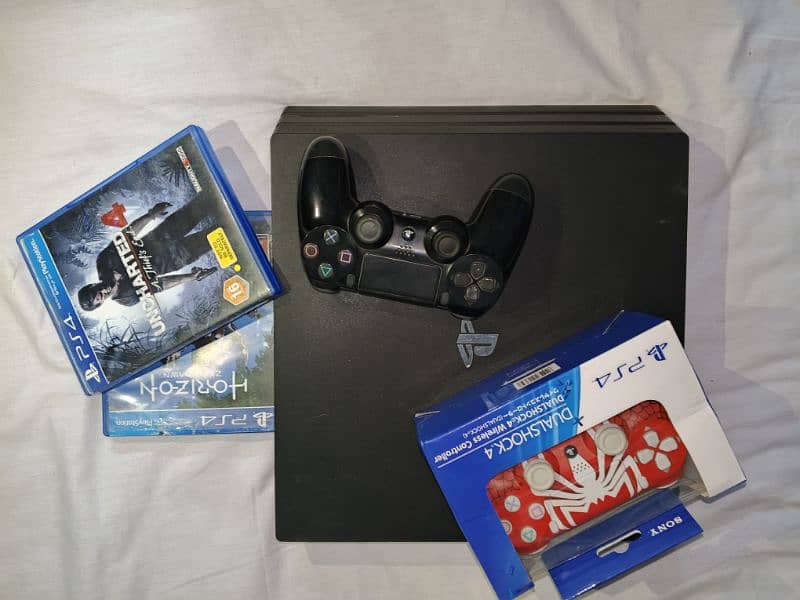 PS4 PRO 1TB With 2 Games and Controllers 1