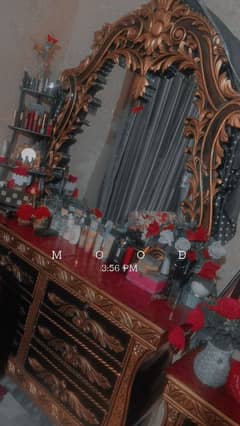 bed and dressing table with side tables