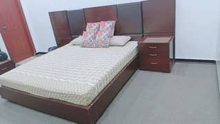 king size double bed with two side tables