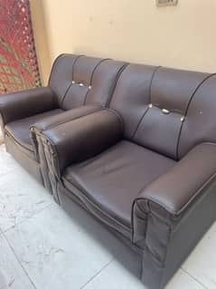 two single seater sofa
