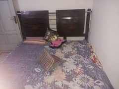 wooden bed with side tables