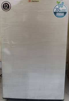 Dawlance mini room size refrigerator.