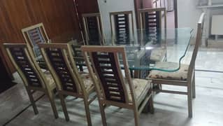glass top dinning table with wooden chairs