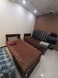 single bed pair with side tables