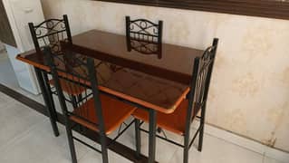 Rot Iron dining table with chairs.