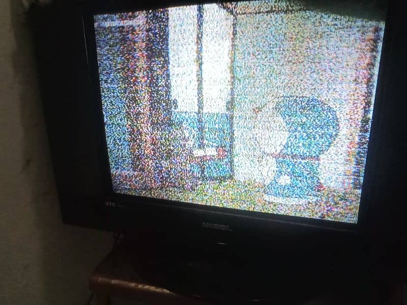 A wooden bed and dressing with side tables Nobel TV 8