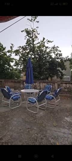 tables and chairs and a umbrella