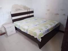 Queen size bed with side table