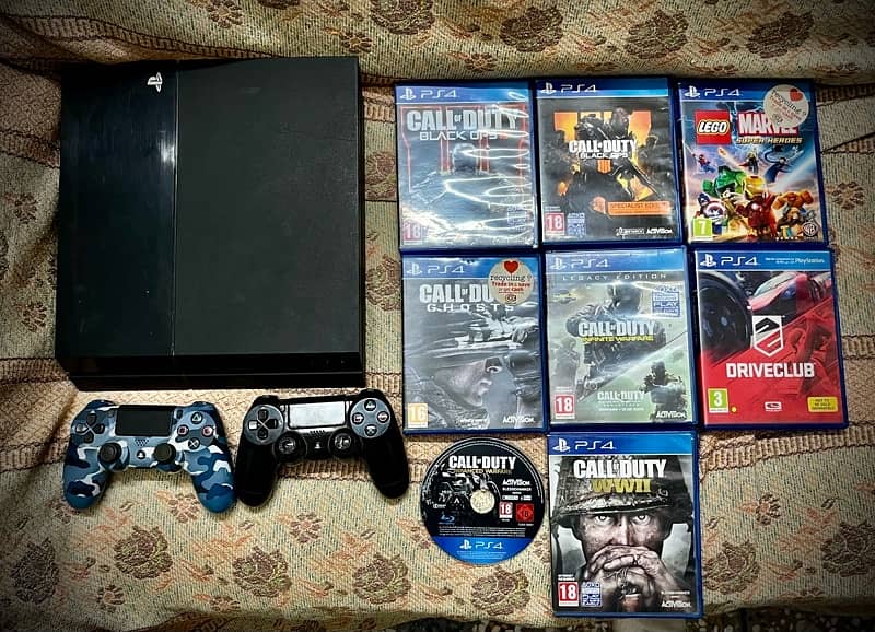 PS4 with 2 controllers and 8 games full settle 0