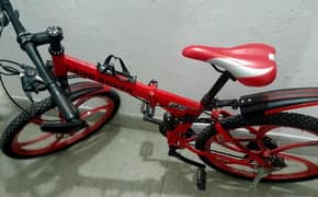 imported bicycle with Alloyrims disk brakes, double shocks light wt
