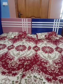 two single beds with side tables