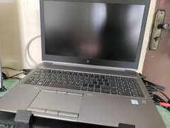 HP zbook g6 15 Laptop with stand, mouse and keyboard.
