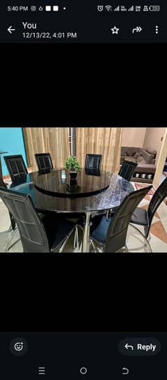 Glass dining table with eight chairs