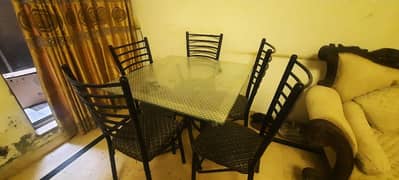8mm glass table. just like brand new. 6 chairs.