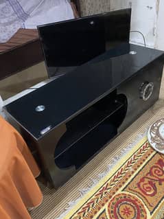Modern Tv trolley in Black colour with glass top