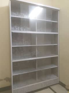 Used storage Table with 12 Storage Sections – Good Condition.