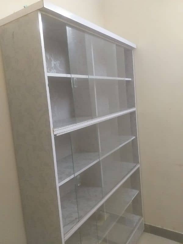 Used storage Table with 12 Storage Sections – Good Condition. 1