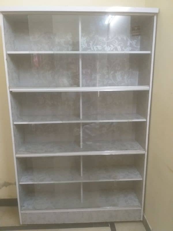 Used storage Table with 12 Storage Sections – Good Condition. 2