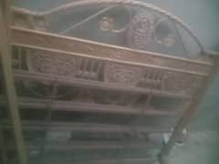 used double bed with one double mattress and one single mattress