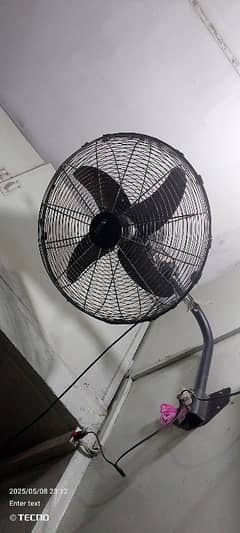 Fan with wall bracket